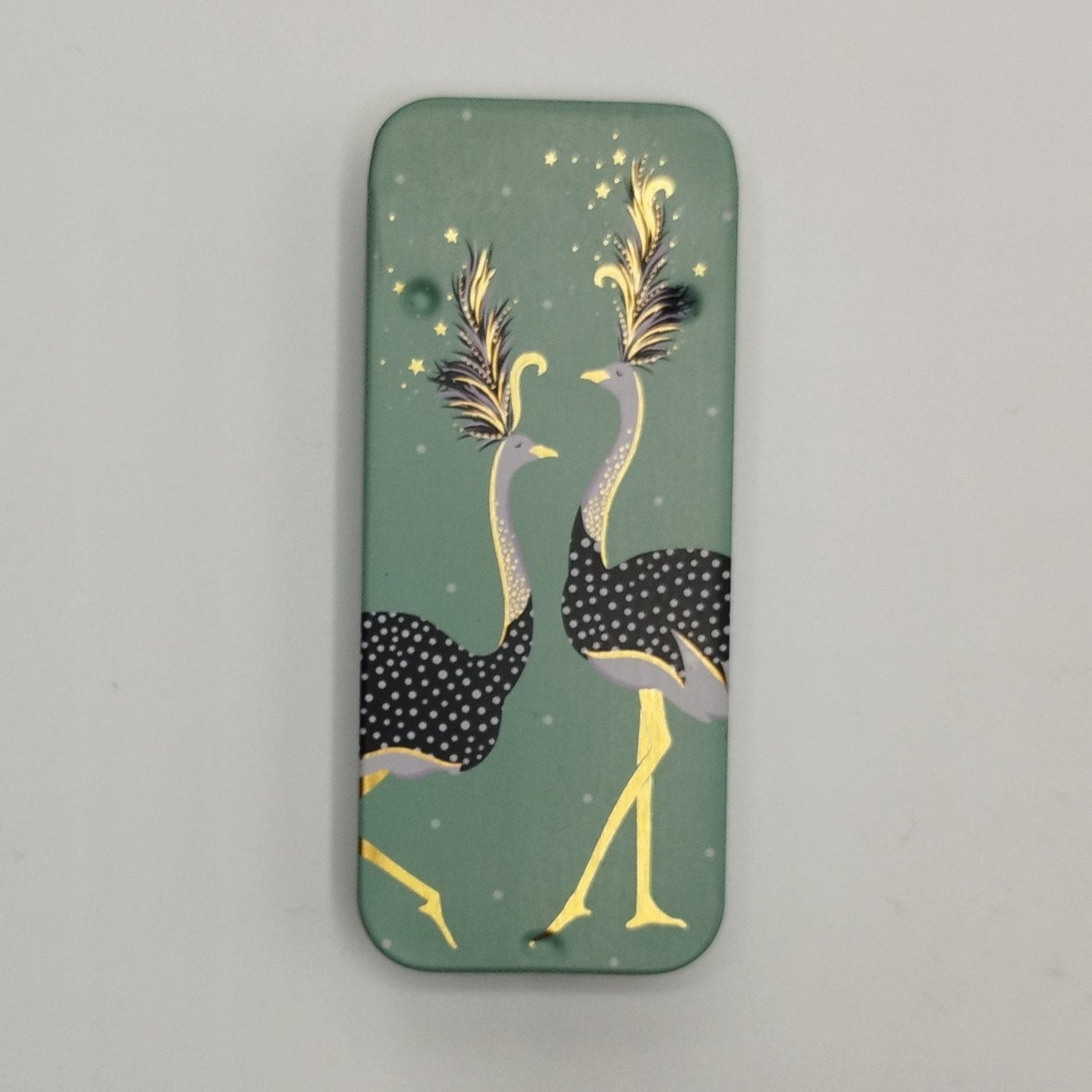 Green slider tin with two ostriches on the lid with gold accents