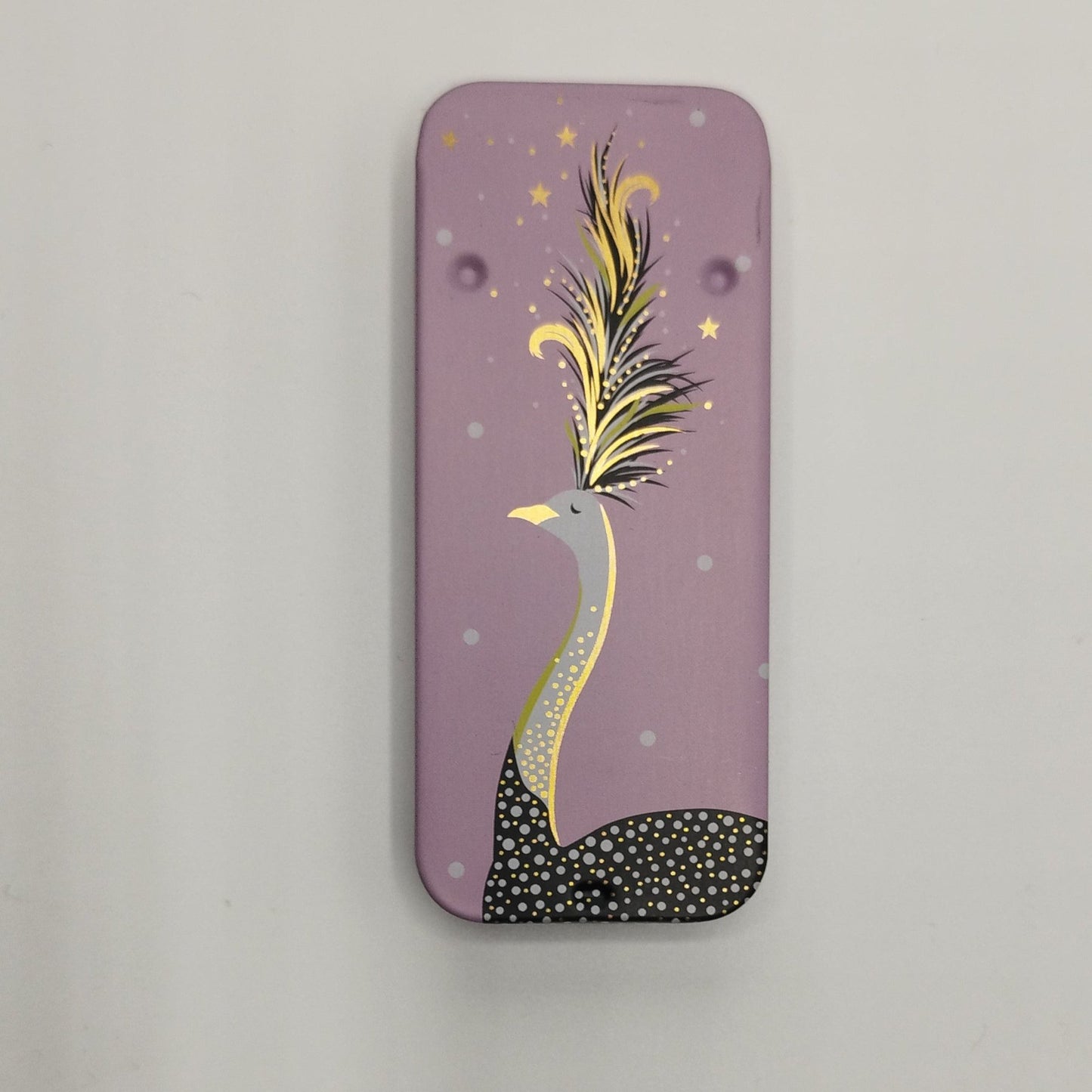 A rectangular pink magnetic needle tin case with a sliding lid, featuring a decorative golden ostrich design with stars and a crescent moon.