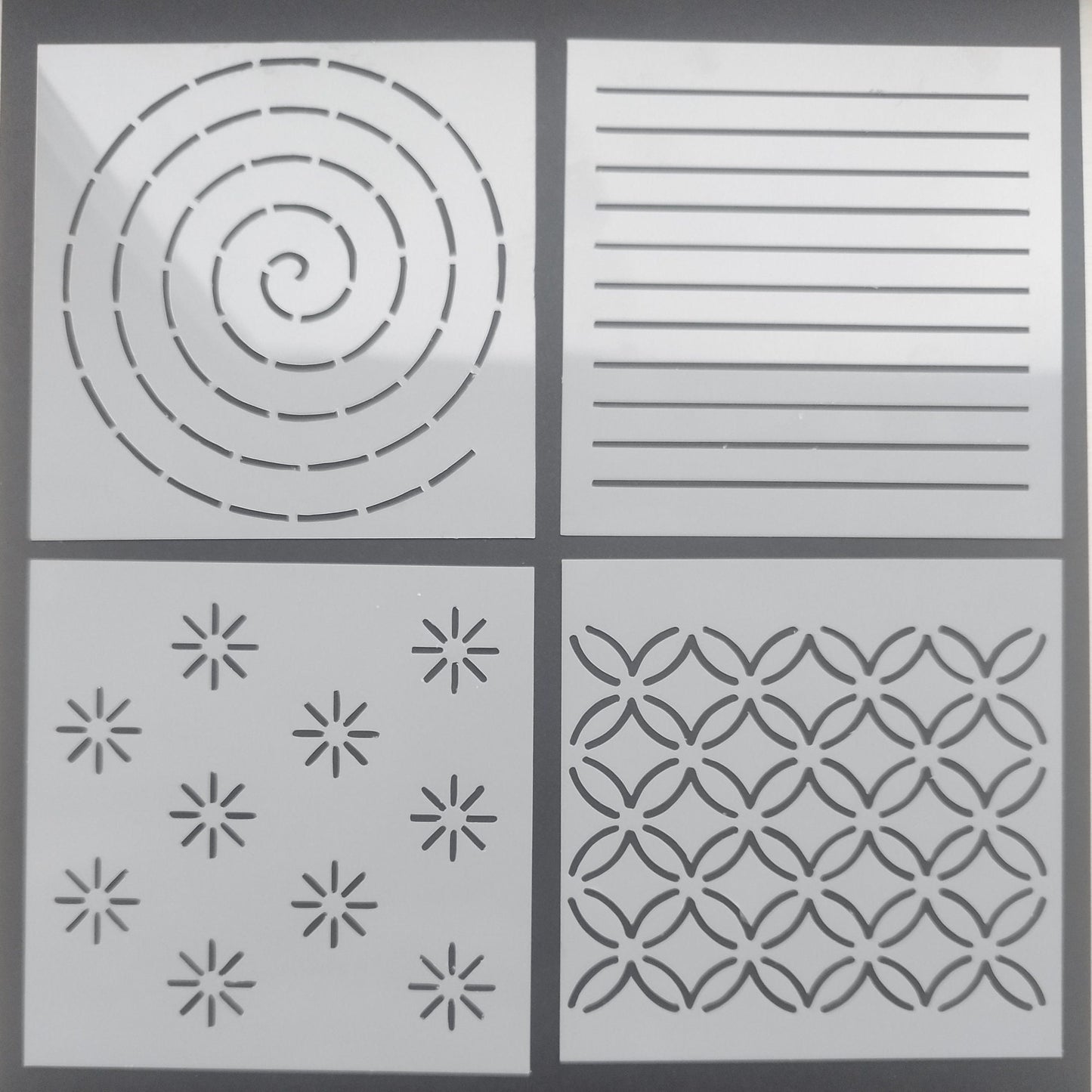 Set of 4 different mending stencils, each with a unique design, displayed against a light background.