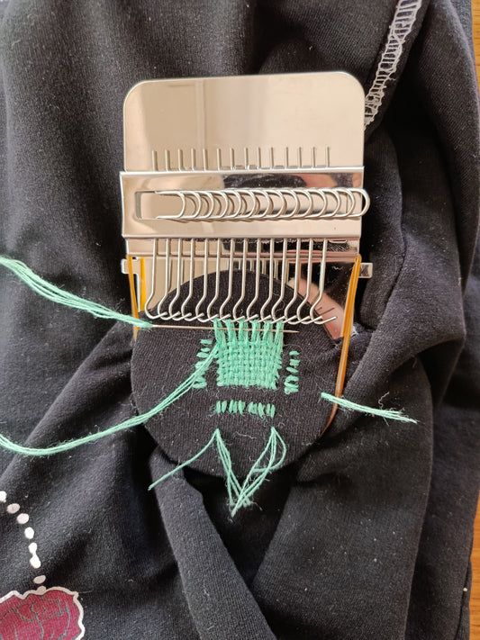 Repairing a hole in my joggers with a mini darning loom