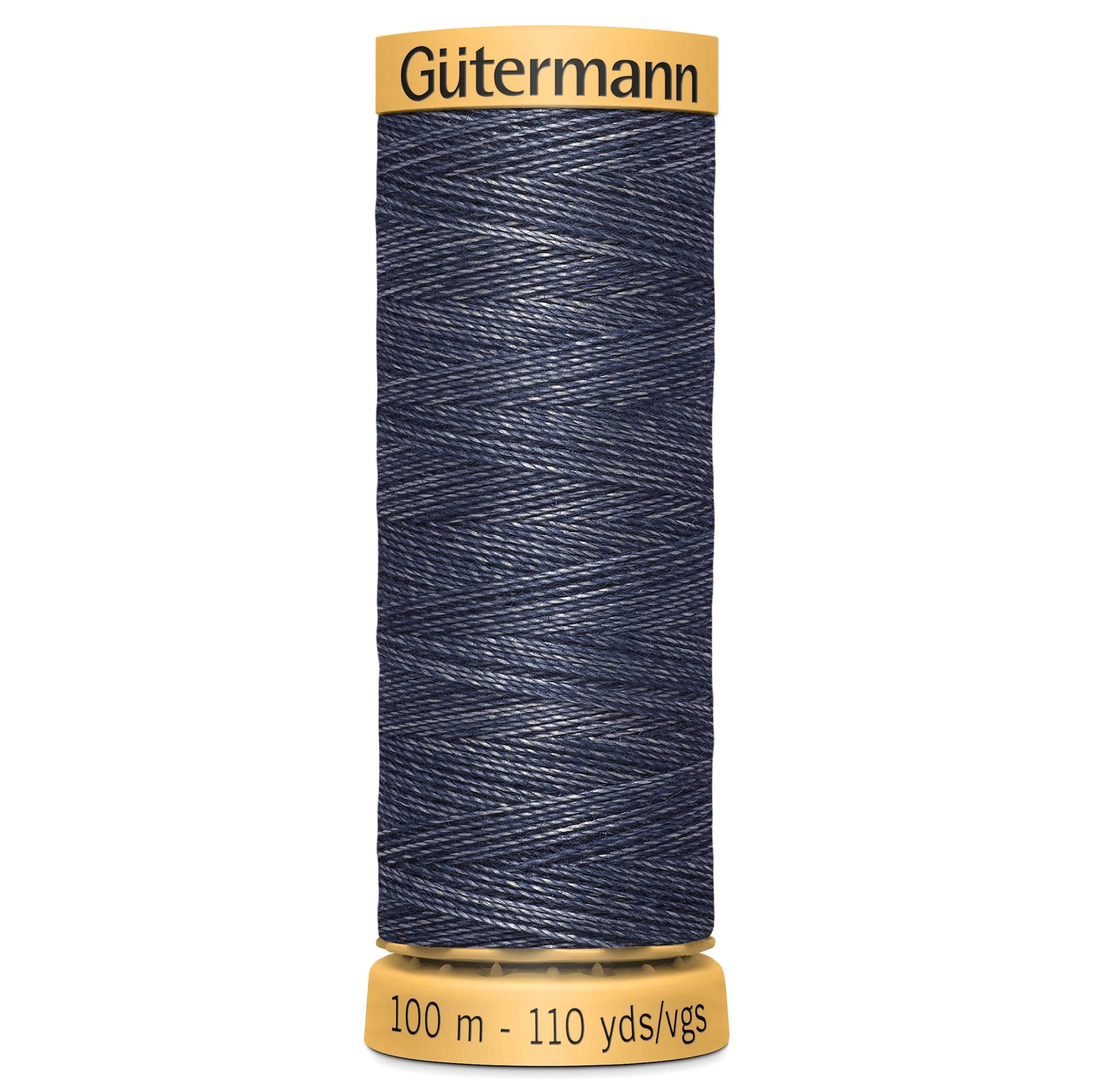 Spool of Gutermann denim thread on a white background