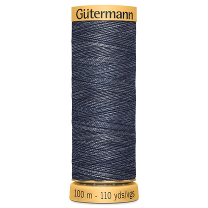 Spool of Gutermann denim thread on a white background
