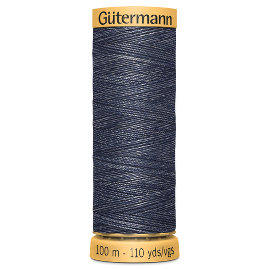 Spool of Gutermann denim thread on a white background