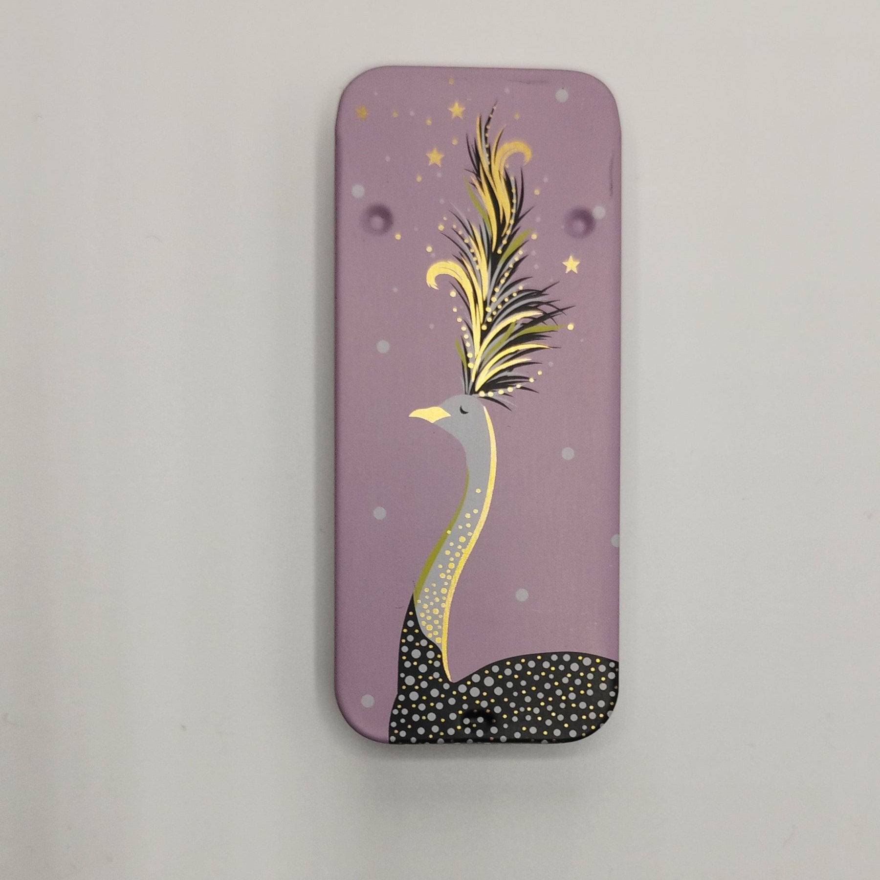 A rectangular pink magnetic needle tin case with a sliding lid, featuring a decorative golden ostrich design with stars and a crescent moon.