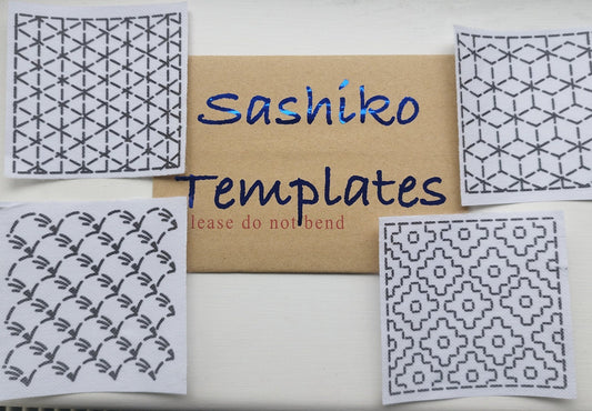 Four Sashiko mending transfers with different geometric patterns, displayed on a table with a card labeled 'SASHIKO TEMPLATES'.