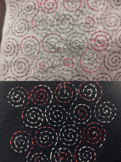 Top half shows pink and white stitching through the sashiko transfer. Bottom half shows the stitching on a dark denim background after the transfer has been washed away.
