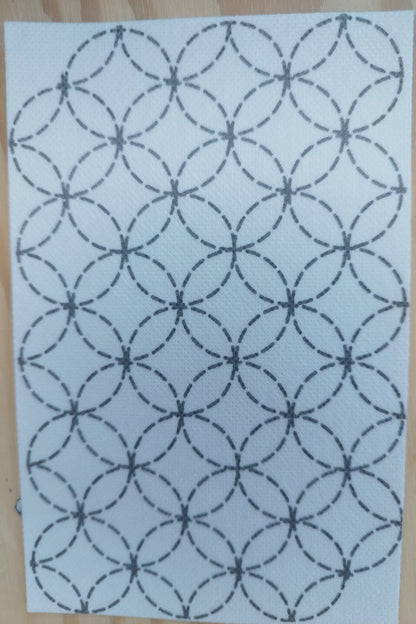 Rectangular sashiko transfer of overlapping circles in dashed black lines on white transfer background
