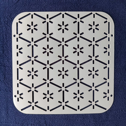 White Stencil of tsuno kikko pattern on a blue background
