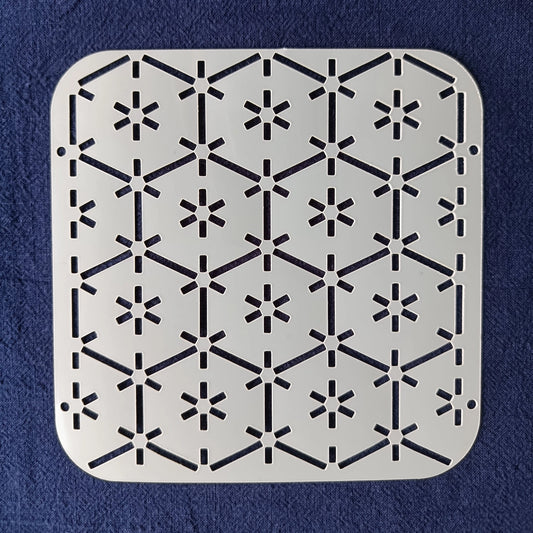 White Stencil of tsuno kikko pattern on a blue background